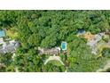 Expansive wooded property with a pool, tennis court, and stately home with circular drive at 510 Heards Ferry Rd, Atlanta, GA 30328