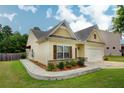 Well-maintained home with a neatly landscaped yard and attached two car garage at 6470 Saint Mark Way, Fairburn, GA 30213