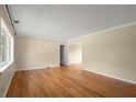 Spacious living room with hardwood floors, neutral paint, and large windows offering plenty of natural light at 1120 Briarcliff Ne Rd # 5, Atlanta, GA 30306