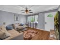 Inviting living room with hardwood floors, neutral paint, comfortable couches, and stylish decorations at 2199 Clairmont Cir, Snellville, GA 30078
