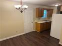 Cozy kitchen and dining area with classic wood cabinets and essential appliances at 796 Cohran Store Rd, Douglasville, GA 30134