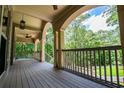 Spacious outdoor porch with a beautiful view of the surrounding greenery at 8040 Banks Mill Rd, Douglasville, GA 30135