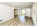 Bright living room with neutral walls, hardwood floors, and an arched window providing natural light at 1947 Main St, Atlanta, GA 30318