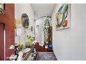 Stylish hallway with wood floors, decorative shelving, and modern artwork at 2404 Fitts Dr, Conyers, GA 30094