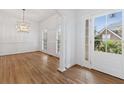 Elegant dining room featuring hardwood floors, decorative molding, and a stylish chandelier at 1711 Summit Glen Ln, Atlanta, GA 30329