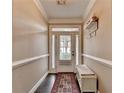 Inviting entryway with hardwood floors, a decorative rug, and ample natural light at 2515 Gadsen Walk, Duluth, GA 30097