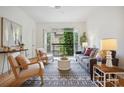 Bright living room with hardwood floors, balcony access and stylish decor at 4254 River Green Dr # 613, Atlanta, GA 30327