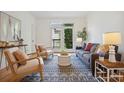 Bright living room with hardwood floors, balcony access and stylish decor at 4254 River Green Dr # 613, Atlanta, GA 30327