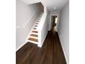 Bright entryway with hardwood floors and a staircase leading to the upper level at 6817 Blackstone Pl # 16, Mableton, GA 30126
