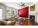 Bright living room featuring a fireplace, hardwood floors, and neutral paint at 7057 Silver Bend Ovrlk, Austell, GA 30168