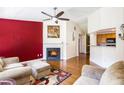 Cozy living room showcasing a fireplace, hardwood floors, and open layout at 7057 Silver Bend Ovrlk, Austell, GA 30168
