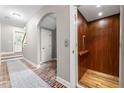 Hallway featuring tile floors, an elevator, and access to the staircase at 2412 St Davids Sq # 16, Kennesaw, GA 30152