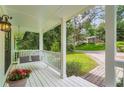 Cozy front porch featuring a swing and a view of the surrounding greenery and neighborhood at 3841 Admiral Dr, Atlanta, GA 30341