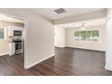 Open floor plan showcasing dark hardwood floors connecting the living room and kitchen at 793 Springdale Sw, Atlanta, GA 30315