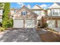 Attractive townhome with stone accents, offering a two-car garage and appealing curb appeal at 1804 Evadale Ct # 1, Mableton, GA 30126