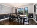 Charming dining room featuring natural lighting, hardwood floors, and a long table at 1452 Crooked Tree Cir, Stone Mountain, GA 30088