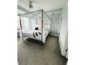 Bright bedroom features a modern canopy bed and ample natural light at 285 Centennial Olympic Park Nw Dr # 1905, Atlanta, GA 30339