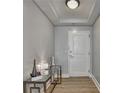 An elegant hallway with a modern console table and stylish decor at 285 Centennial Olympic Park Nw Dr # 1905, Atlanta, GA 30339