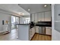Sleek, modern kitchen with stainless steel appliances and a breakfast bar at 285 Centennial Olympic Park Nw Dr # 1905, Atlanta, GA 30339