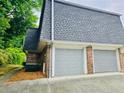 Attached two car garage offering convenience and additional storage space at 1128 Hampton Way, Atlanta, GA 30324