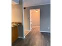 Hallway featuring hardwood floors, neutral paint and access to living spaces and bedrooms at 3160 Seven Pines Unit 105 Ct, Atlanta, GA 30339