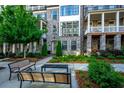 Beautiful townhome with lush front yard landscaping, patio and brick facade at 414 Concord St, Alpharetta, GA 30009
