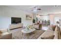 Inviting living room with stylish decor, open to a modern kitchen at 235 Orchard Dr, Covington, GA 30014