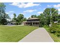 Charming two-story home with a welcoming front porch and lush green lawn at 5254 Greenpoint Drive, Stone Mountain, GA 30088