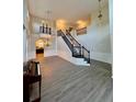 Bright and airy living room with a staircase, hardwood floors, and ample natural light at 5688 Baffin Rd, Atlanta, GA 30349