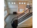 Bright and airy living room, hardwood floors, and ample natural light from upper windows at 5688 Baffin Rd, Atlanta, GA 30349