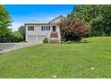 Inviting two-story home featuring a well-manicured front lawn and classic curb appeal at 33 Moriah Ne Way, Rydal, GA 30171