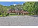 Inviting condo complex with mature trees, manicured landscaping, and ample parking at 2972 Parc Lorraine, Lithonia, GA 30038