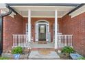 Charming front porch with rocking chairs and lovely decor, creating a cozy and inviting entrance at 20 Friendship Rd, Euharlee, GA 30145