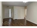 Spacious living room with hardwood floors and neutral wall paint at 504 Edgewood Trce, Mcdonough, GA 30253