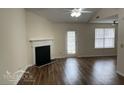 Bright living room featuring a fireplace, hardwood floors, and a glass door to the outside at 504 Edgewood Trce, Mcdonough, GA 30253
