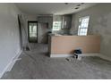 Kitchen showing unfinished cabinets with open access to the living room at 854 Mcdonough Se Blvd, Atlanta, GA 30315