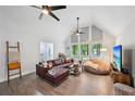 Sunlit living room with vaulted ceilings, stylish furniture, and an inviting, airy feel at 5077 Martindale Ln, Stone Mountain, GA 30088