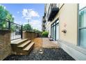 Private patio area with space for outdoor seating and relaxation; landscaped with mulch, stone, and brick at 5300 Peachtree Rd # 1608, Chamblee, GA 30341