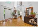 Bright foyer with hardwood floors, high ceilings, and elegant decor, creating a welcoming entrance at 3438 Winborn Walk Northwest Nw, Kennesaw, GA 30152