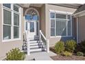 Welcoming front porch with well-manicured landscaping and a stylish front door and plenty of natural light at 5690 Rutland Trce, Lithonia, GA 30058