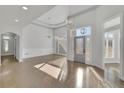 Bright and airy living room with sleek floors, designer lighting, and a stylish door at 5690 Rutland Trce, Lithonia, GA 30058