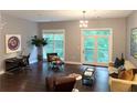 Inviting living room featuring hardwood floors, ample natural light, and stylish contemporary furnishings at 560 Dutch Valley Road # 2412, Atlanta, GA 30324