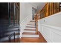 Welcoming entryway featuring hardwood floors, decorative moldings, and a staircase with an iron railing at 2873 Overlook Ne Way, Atlanta, GA 30324