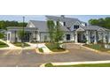 Modern clubhouse exterior with well-maintained landscaping and convenient parking at 753 Brooke View Drive, Canton, GA 30115