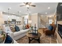 Open-concept living room with a modern kitchen and comfortable seating area at 22 Jacobs Farm Ln # 11, Lawrenceville, GA 30045