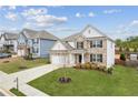 Beautiful two-story home boasts a well-kept lawn, attractive landscaping, and classic design elements at 4365 Sunflower Cir, Cumming, GA 30040