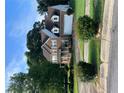 Attractive two-story brick house with a two-car garage, complemented by well-maintained landscaping and mature trees at 978 Francis Ln, Fairburn, GA 30213
