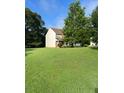 Spacious lawn surrounding a two-story home, offering a serene and inviting atmosphere at 978 Francis Ln, Fairburn, GA 30213