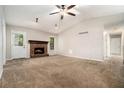 Inviting living room features a brick fireplace, vaulted ceiling, and ample natural light at 647 Sunshine Nw Trce, Acworth, GA 30102
