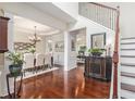 Elegant dining room with hardwood floors, chandelier, trim accents, and access to living spaces at 122 Susobell Pl, Woodstock, GA 30188